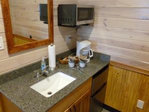 Coffee bar with second sink, coffee maker, microwave and undercounter refrigerator